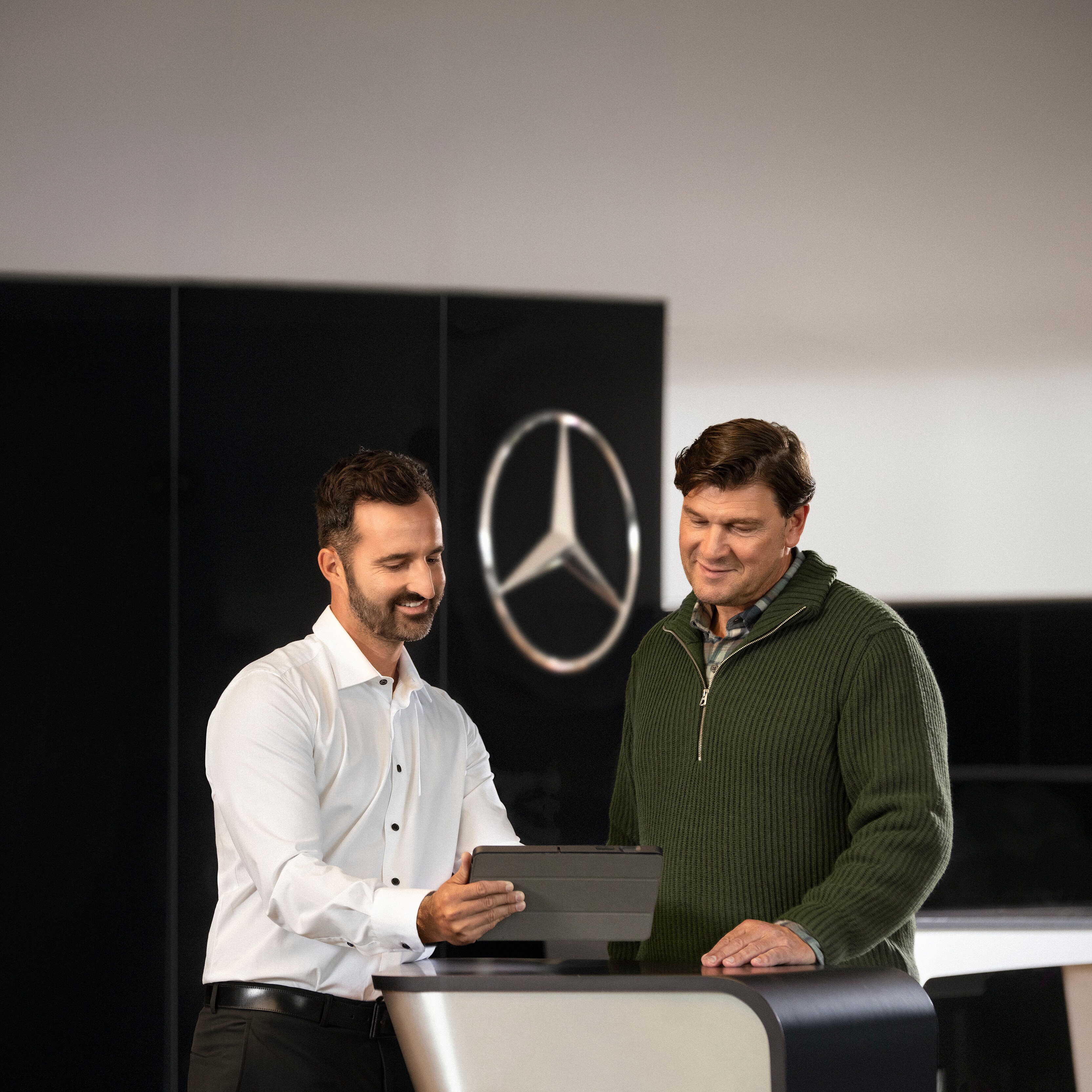 A Mercedes-Benz representative speaking to a customer